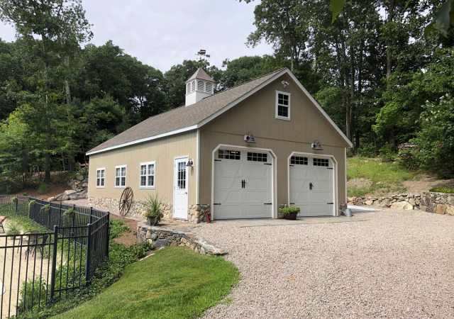 24’ x 40’ 8 Pitch Garage built on top of customer’s 22’’ high stem wall. Shown with optional 9’ x 8’ Custom Carriage Doors and 42’’ Elite Cupola